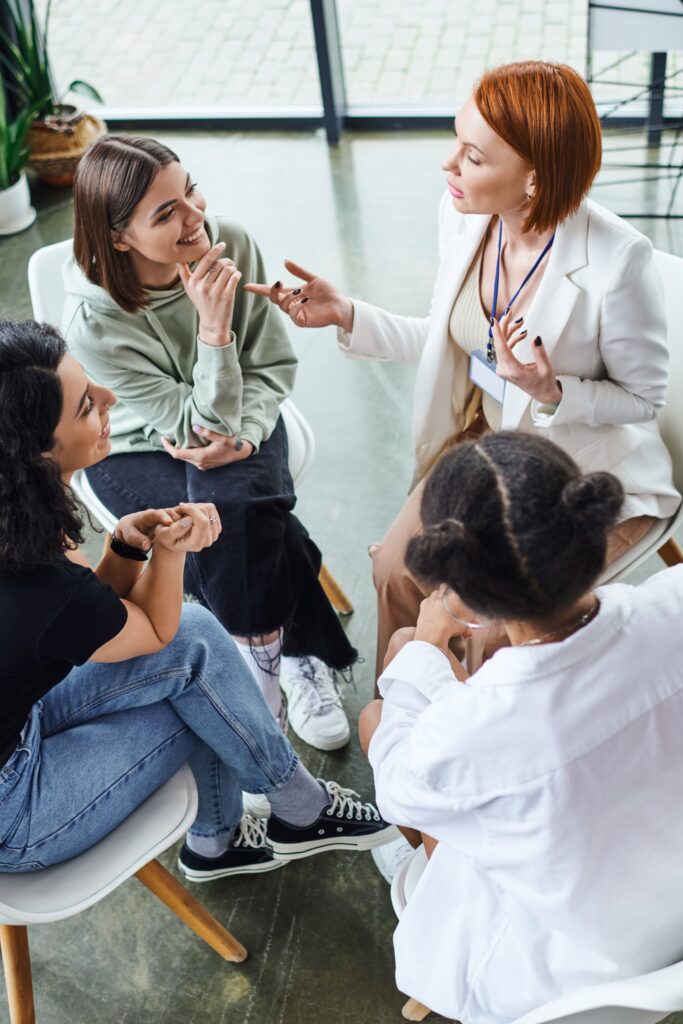 People participate in group therapy at an alcohol rehab.