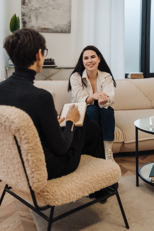 A woman participates in therapy as part of gambling addiction treatment.